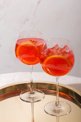 Spritz veneziano, an IBA cocktail, with Prosecco or white sparkling wine, bitter, soda, ice and a slice of orange, in a calix on a table, pop graphic style