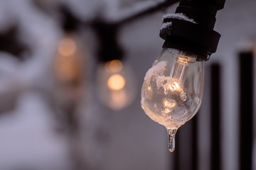Frozen lit light bulb