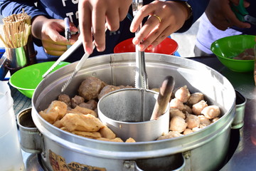 buyer preparing meatballs food