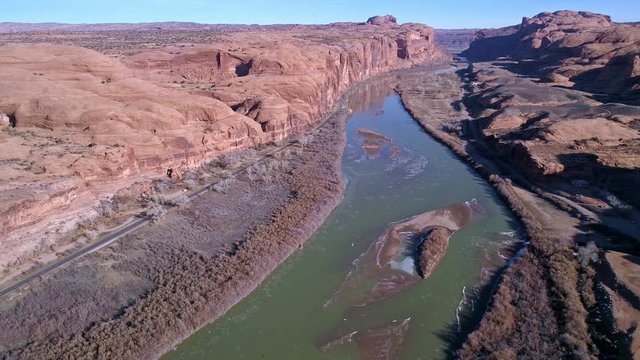 Aerial view above the Colorado River near Moab panning across over Potash road in Utah.