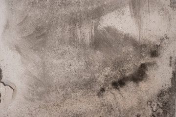 black fungus or soot on the concrete wall old material ruined by the weather