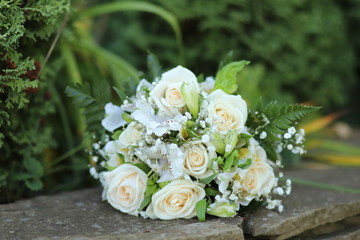 wedding bouquet with roses on the grass