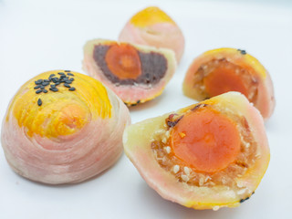 Close up Spring Roll pastry with nuts, salted eggs on isolate white background.Delicious Chinese pastry .