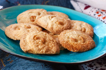 home-made cashew nut cookies, grandma's style on blue plate