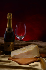 cheese and wine on old wooden table