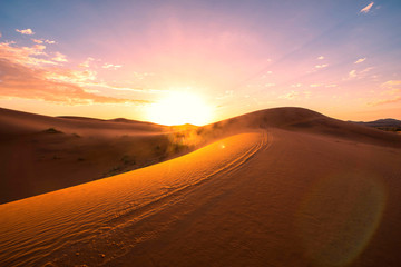Fototapeta na wymiar The beauty of the sand dunes in the Sahara Desert in Morocco