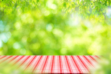 Empty table and picnic on abstract background for Your photomontage or product display. - obrazy, fototapety, plakaty