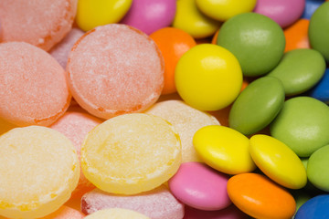 Many sweet colorful candies background. Macro horizontal color photography.