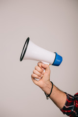 cropped view of man holding megaphone, isolated on grey