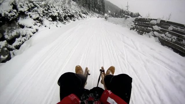 A Pov Shot Of A Toboggan Downhill Run At Day In Winter In Austria