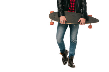 low section view of skateboarder posing with longboard isolated on white