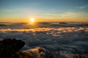 sunrise and sea of fog view on phu chi fa mountain area and national forest park in chiang rai,...