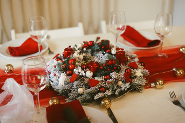 serving Christmas table. Christmas wreath