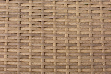 Synthetic rattan texture weaving background. Brawn plastic basket Background. Plastic rattan texture background