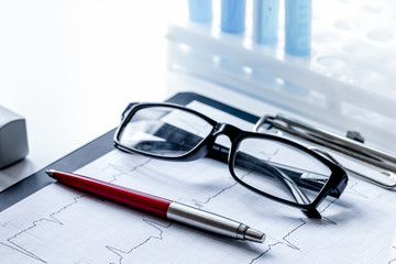 Fototapeta premium doctors desk with microscope and test tubes