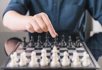 Businessman play with chess game. concept of business strategy and leadership