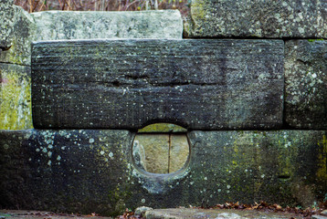 Megalithic building of the bronze age, the dolmen of village Pshada, the Caucasus, Russia (film photo)