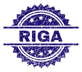 RIGA stamp seal watermark with distress style. Blue vector rubber print of RIGA tag with grunge texture.