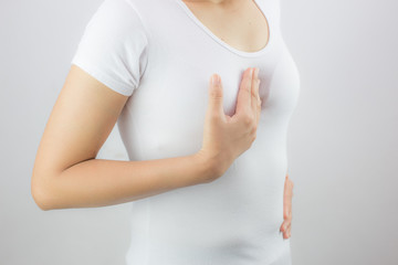 Women face painful symptoms due to acid reflux on a white background / concept of health care and...