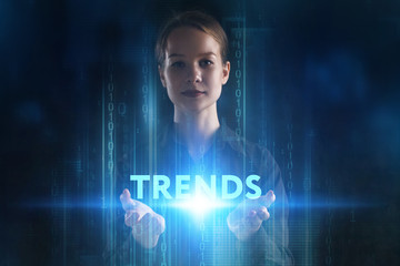 The concept of business, technology, the Internet and the network. A young entrepreneur working on a virtual screen of the future and sees the inscription: Trends