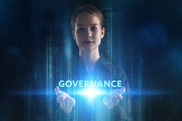 The concept of business, technology, the Internet and the network. A young entrepreneur working on a virtual screen of the future and sees the inscription: Governance