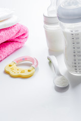 preparation of mixture baby feeding on white background