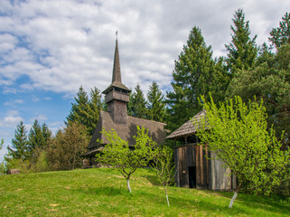 Fototapeta na wymiar Scenic spring rural landscape with traditional maramures neo-gothic church, Maramures, Romania