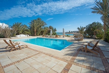 Swimming pool at at luxury tropical holiday villa resort