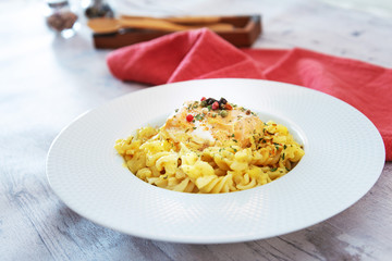 tasty pasta with salmon on a the table