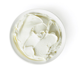 Cream cheese, quark or yogurt in a white bowl. Dairy product, healthy eating theme. Isolated object on white background.