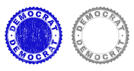 Obraz premium Grunge DEMOCRAT stamp seals isolated on a white background. Rosette seals with distress texture in blue and grey colors. Vector rubber stamp imitation of DEMOCRAT title inside round rosette.
