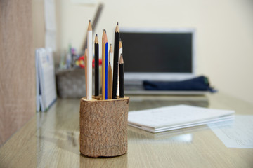 Group of pencil on table.