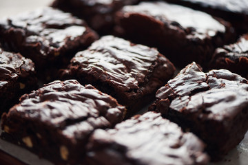Homemade chocolate brownies sittiing on a bakery counter