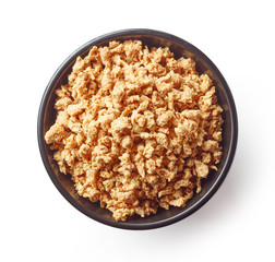 Bowl of soya chunks isolated on white, from above