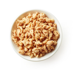 Bowl of soya chunks isolated on white, from above