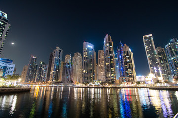 Obraz na płótnie Canvas Dubai, UAE - April 2013: The skyscrappers around the marina at night