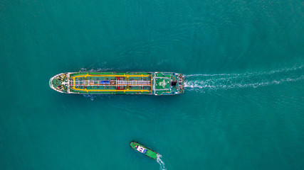 Tanker ship aerial view, oil tanker and gas tanker sailing in open ocean.
