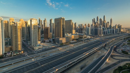 Fototapeta na wymiar Dubai Marina skyscrapers aerial top view at sunrise from JLT in Dubai timelapse, UAE.