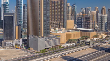 Naklejka na ściany i meble Dubai Marina skyscrapers aerial top view at morning from JLT in Dubai timelapse, UAE.