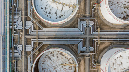 Tank farm or oil terminal for storage of oil and petrochemical products, Aerial view.