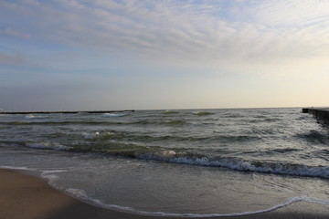 a sea wave that aspire to shore during a little storm
