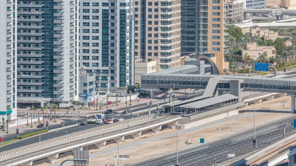 Naklejka premium Aerial view of Dubai Tram in Dubai marina timelapse.
