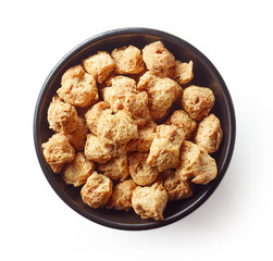 Bowl of soya chunks isolated on white, from above