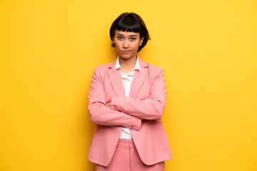 Modern woman with pink business suit frustrated by a bad situation