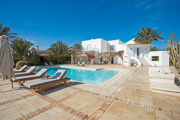 Swimming pool at at luxury tropical holiday villa resort