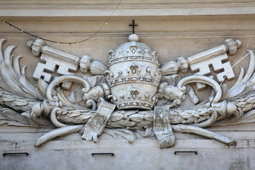 Papal coat of arms at St Peter's Church in Parma, Italy