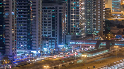 Fototapeta na wymiar Aerial view of Dubai Tram in Dubai marina night timelapse.