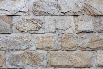 The wall of natural stone which is fenced house
