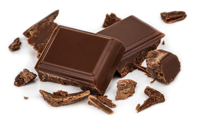 Milk chocolate pieces isolated on white background from top view