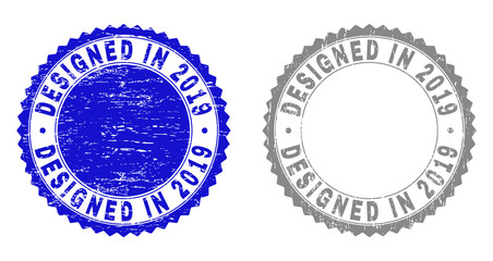Grunge DESIGNED IN 2019 stamp seals isolated on a white background. Rosette seals with distress texture in blue and grey colors.